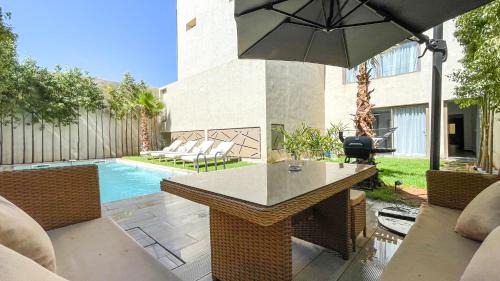 Annakhil Villa | Villa AZUR: Poolside Paradise in Marrakech with Ocean Views