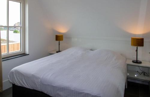 Delfstrahuizen Villa | Inviting Villa with Sauna and Scenic Views for Families