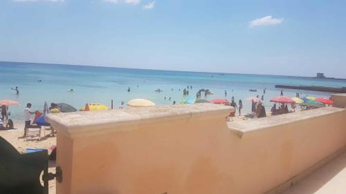 Torre Lapillo Villa | Beachfront Villa with Veranda and Pet-Friendly Amenities