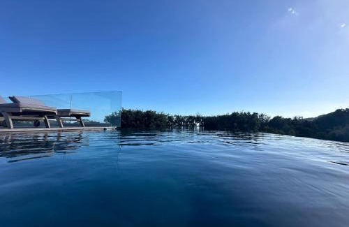 Pianotolli-Caldarello Villa | Oceanfront Villa with Infinity Pool & 4-Star Comfort