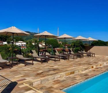 Lindoia Hotel | Experience Villa do Éden: Poolside Oceanfront Getaway