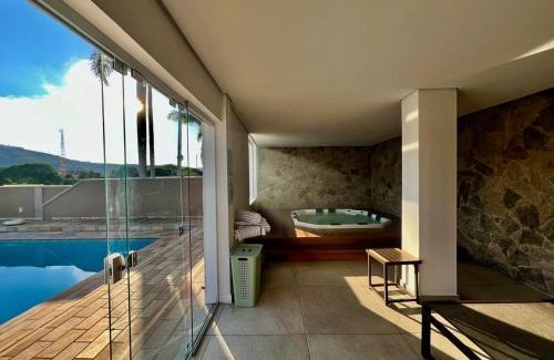 Lindoia Hotel | Experience Villa do Éden: Poolside Oceanfront Getaway