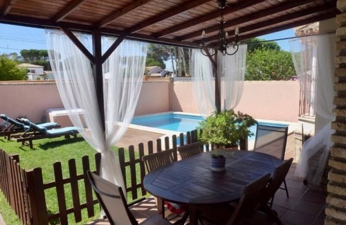 Chiclana de la Frontera Villa | Beautiful Villa Steps from the Beach with Pool & Ocean View