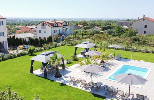 Vilanija Apartment | Villa Esea: Poolside Retreat with Hot Tub & Family Fun