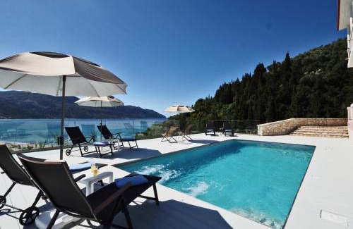 Afionas Apartment | Experience Villa Euphoria Apts with Oceanfront Pool Views