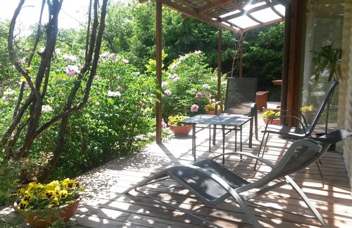 Business District Villa | Villa EverGreen: Downtown Retreat with Private Garden & Hot Tub