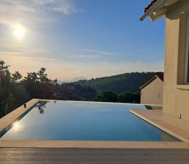 Troulos Villa | Discover Villa George: Oceanfront Retreat in Skiathos