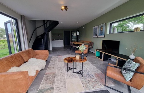 Balk House | Elegant Water Villa Retreat with Jetty for Family Getaways