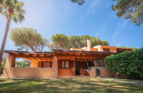 Santa Margherita di Pula Villa | Idyllic Villa Steps from the Beach with Garden Oasis