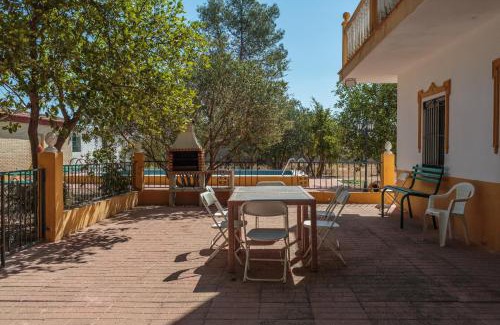 Marchena Villa | Experience Villa Los Pinos: Family-Friendly with Pool