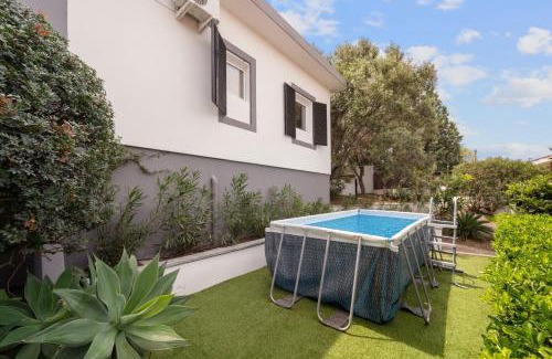 Sarroch House | Discover Villa Matteo: Poolside Retreat with Family Amenities