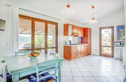 Capo d'Orso Apartment | Villa Maria Trilocale: Oceanfront Retreat with Breakfast