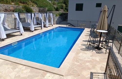 Trilj Villa | Villa Marija: Oceanfront Retreat with Heated Pool & Hot Tub