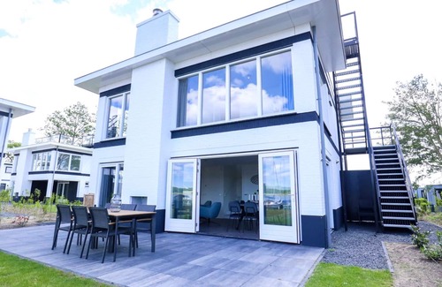 Nijkerk House | Villa Meerzicht 8: Lake View Getaway with Spa Amenities