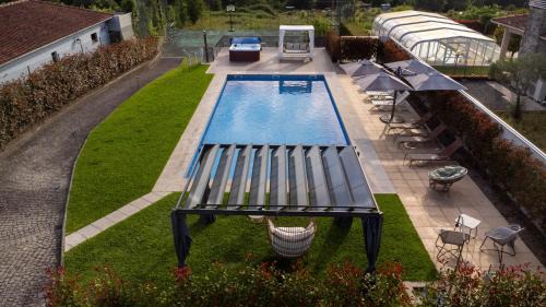 Povoa de Lanhoso House | Villa Moura: Poolside Retreat with Ocean Views & Hot Tub