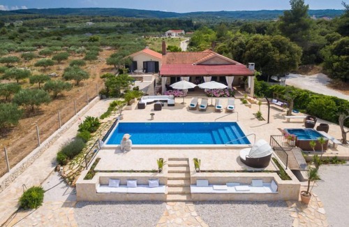 Supetar House | Indulge in Villa Mutnik: Oceanfront Escape with Pool