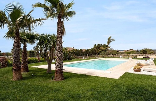 Modica Apartment | Villa Paradiso: Poolside Oasis with Ocean Views & Fireplace
