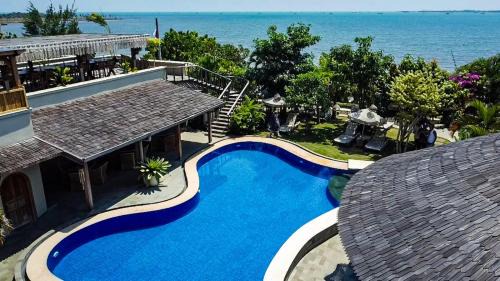 Mlonggo Resort | Villa Suerte: Oceanfront Retreat with Private Beach Access