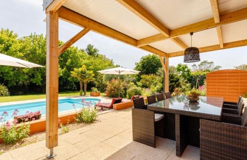 Les Sables d'Olonne Villa | Pet-Friendly Villa Les Cygnes with Pool & Kitchen Amenities