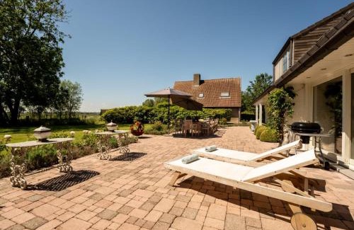 De Haan Villa | Family Retreat at Villa Rosetree with Relaxing Hot Tub