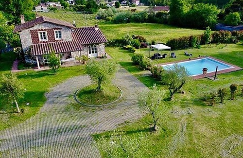 Capannori Villa | Inviting Villa with Garden, Heated Pool & Oceanfront Views