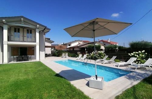 Peschiera del Garda Villa | Villa Zarina: Oceanfront Getaway for Up to 12 Guests