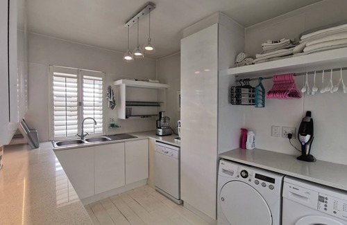 Plettenberg Bay Apartment | Cozy Village Square 10: Oceanfront Getaway with Restaurant