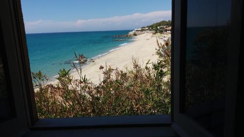 Ricadi Apartment | Discover Villaggio Camping Fiorina: Pet-Friendly Paradise