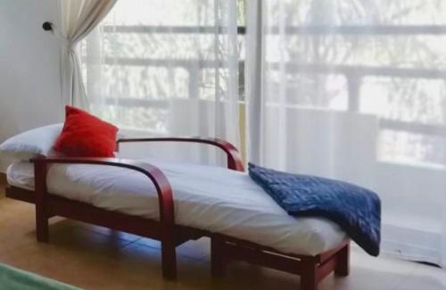 Tres de Mayo Apartment | Discover Villas de Brisas: Family-Friendly with Pool & Kitchen