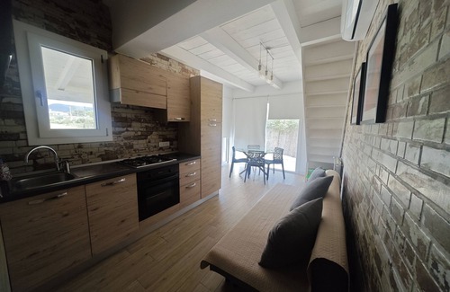 Sant'Anna Arresi Villa | Cozy Villetta Fanny Romantica: Ideal for Families & Pets