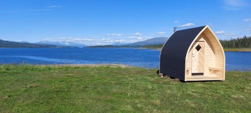 Hattfjelldal House | Discover Villmarksgård: Cozy Cabin by the Water