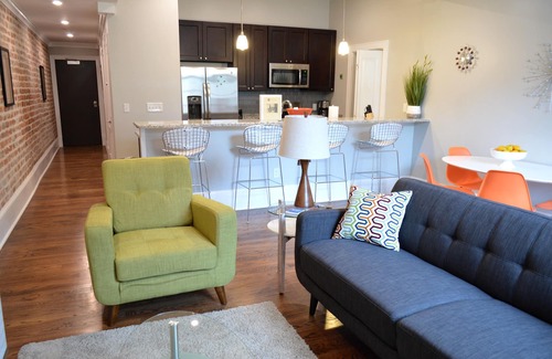 Central Business District Condo | Vintage Advertisements Themed Condo Near French Quarter