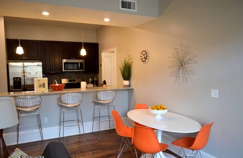 Central Business District Condo | Vintage Advertisements Themed Condo Near French Quarter