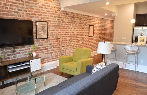 Central Business District Condo | Vintage Advertisements Themed Condo Near French Quarter