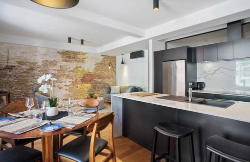 Hobart Central Business District Apartment | Discover Saddlers House: Vintage Suite with Café Vibes