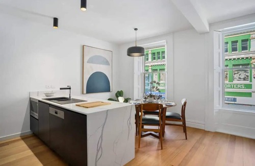 Hobart Central Business District Apartment | Discover Saddlers House: Vintage Suite with Café Vibes