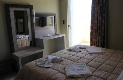 Polirizos Apartment | Oceanfront Virgin Mary: Guest Rated 9.4 with Family-Friendly Amenities