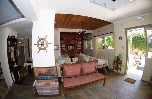 Vathi Hotel | Discover Virginia Hotel: Family-Friendly with Pool & Eco Perks