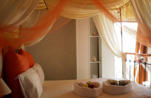 Vathi Hotel | Discover Virginia Hotel: Family-Friendly with Pool & Eco Perks
