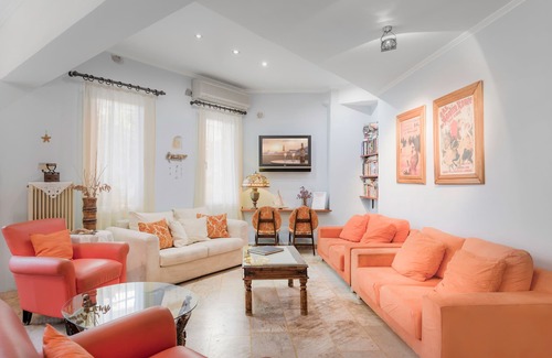 Vathi Hotel | Discover Virginia Hotel: Family-Friendly with Pool & Eco Perks