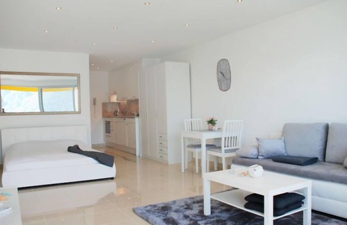 Locarno Apartment | Experience Vista Panorama: Pool, Spa & Lake Views Await