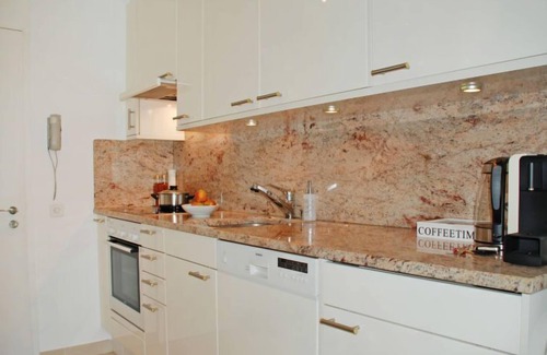 Locarno Apartment | Experience Vista Panorama: Pool, Spa & Lake Views Await