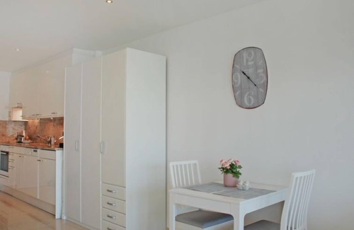 Locarno Apartment | Experience Vista Panorama: Pool, Spa & Lake Views Await