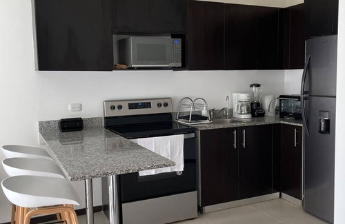Canton Quepos Apartment | Experience Serenity by the Sea: Pool, Spa & Surf Await