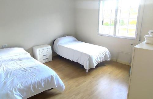 Isla de Arosa House | Inviting Complete Stay Steps from the Beach for Families