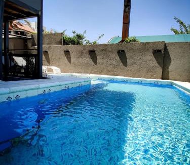 Villa Carlos Paz Cabin | UNICA Casa Centro: Lakefront Retreat with Heated Pool