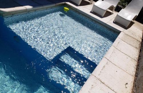 Villa Carlos Paz Cabin | UNICA Casa Centro: Lakefront Retreat with Heated Pool