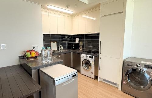 Songdo Apartment | W 2BR 60m2 Newly Built High Floor APT 2min to Hyundai Outlet Triple St 2Free Parking