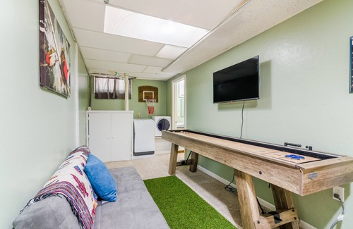 Manhattan House | Inviting Brick Cottage with Man Cave near Aggieville