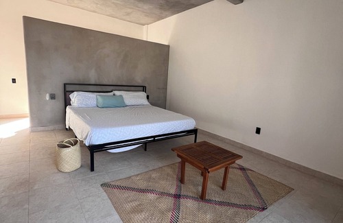 Troncones Bed & Breakfast | Warm room with the sea in the background and starry skies.